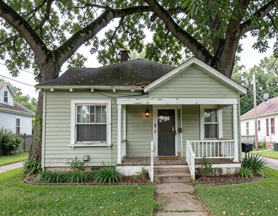 Inherited Florida home under a large tree